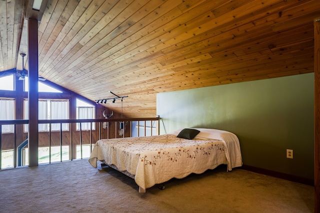 carpeted bedroom with wooden ceiling and vaulted ceiling