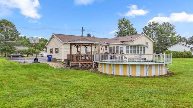 4060 Wilawana Rd, Sayre, PA 18840 - back of house with a gazebo, a wooden deck, an outdoor pool, and a yard