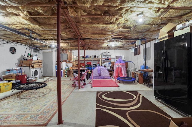 4060 Wilawana Rd, Sayre, PA 18840 - unfinished below grade area featuring black fridge with ice dispenser