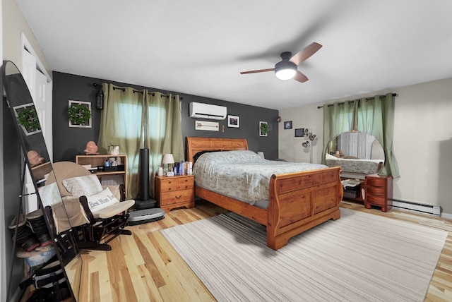 4060 Wilawana Rd, Sayre, PA 18840 - bedroom featuring a wall unit AC, light wood-style floors, and a ceiling fan