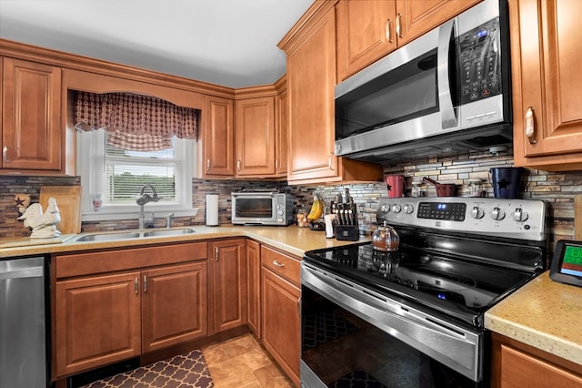 4060 Wilawana Rd, Sayre, PA 18840 - kitchen with stainless steel appliances, backsplash, and light countertops