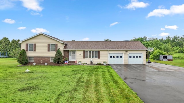 4060 Wilawana Rd, Sayre, PA 18840 - tri-level home with driveway, a garage, a front yard, and a shingled roof
