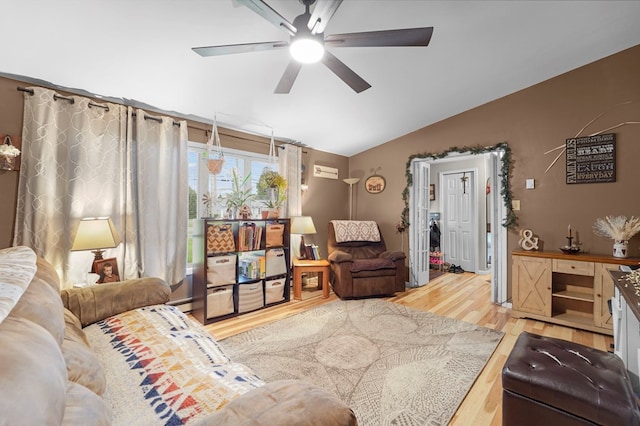 4060 Wilawana Rd, Sayre, PA 18840 - living area with vaulted ceiling, ceiling fan, wood finished floors, and a baseboard radiator