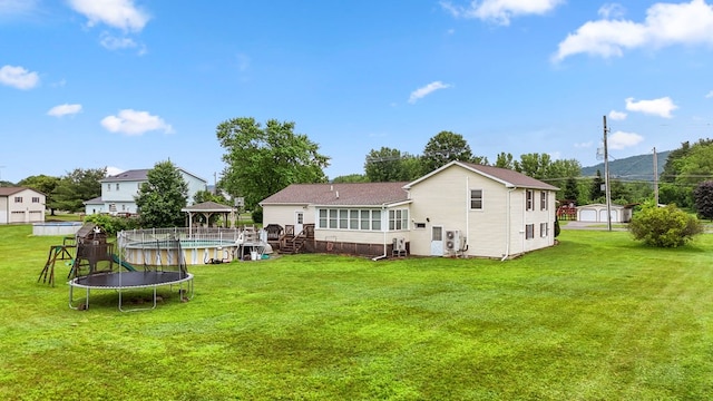4060 Wilawana Rd, Sayre, PA 18840 - rear view of property featuring a gazebo, a trampoline, and a yard