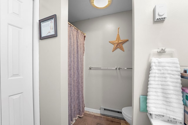 4060 Wilawana Rd, Sayre, PA 18840 - full bathroom featuring a baseboard radiator, wood finished floors, and a shower with shower curtain