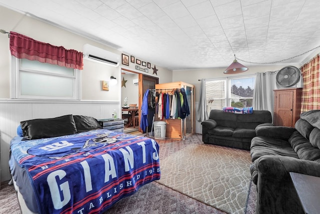 4060 Wilawana Rd, Sayre, PA 18840 - bedroom featuring a wall mounted air conditioner, a walk in closet, and carpet