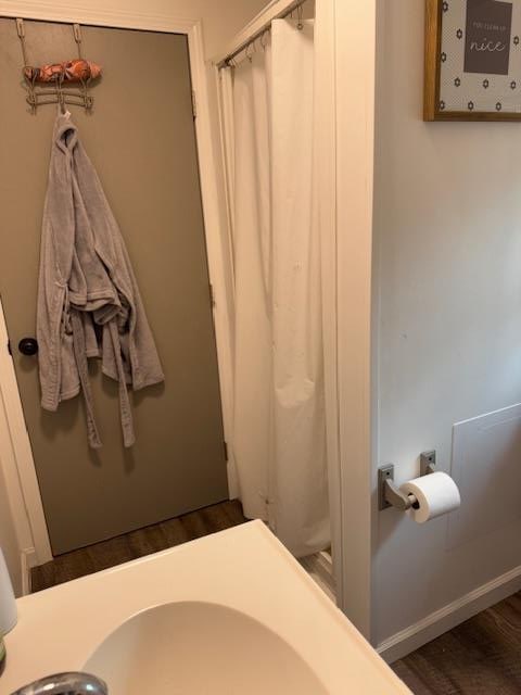 bathroom featuring wood-type flooring