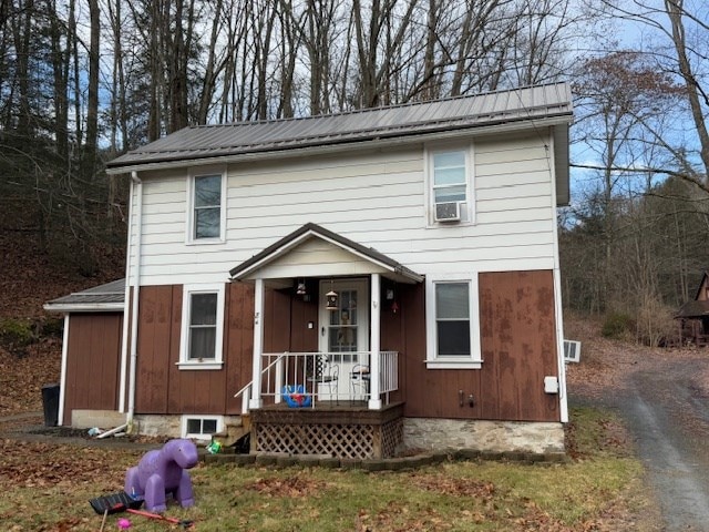 view of front property with cooling unit