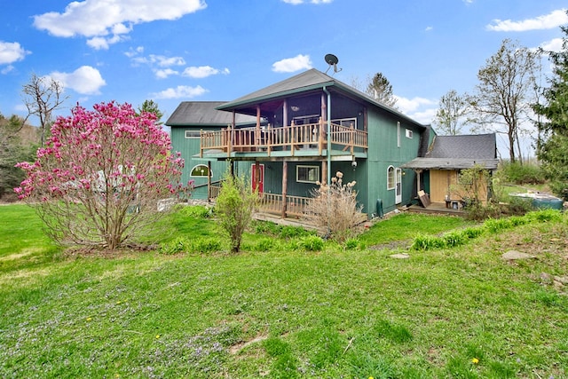 157 Shelmire Rd, Wellsboro, PA 16901 - back of house featuring a sunroom, a deck, and a lawn