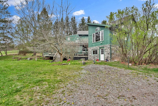 157 Shelmire Rd, Wellsboro, PA 16901 - back of house featuring a yard, stone siding, and a deck
