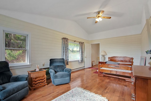 157 Shelmire Rd, Wellsboro, PA 16901 - bedroom featuring lofted ceiling, a baseboard radiator, wood walls, and wood finished floors