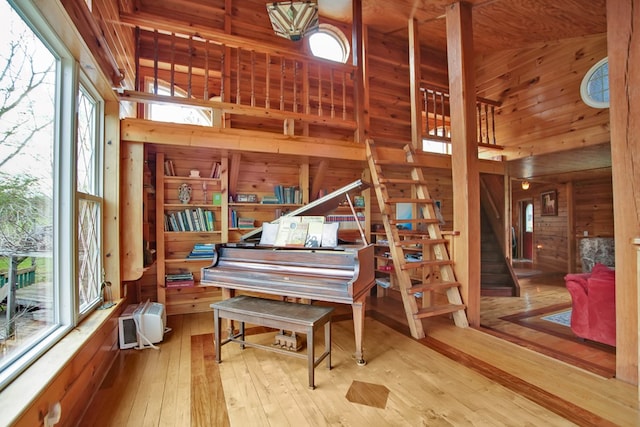 157 Shelmire Rd, Wellsboro, PA 16901 - interior space with wooden walls, a towering ceiling, wood-type flooring, and stairs