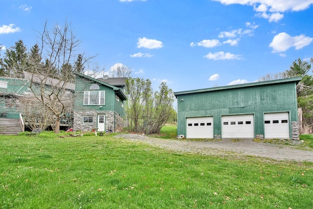 157 Shelmire Rd, Wellsboro, PA 16901 - view of side of property featuring stone siding, a yard, an outdoor structure, and a garage