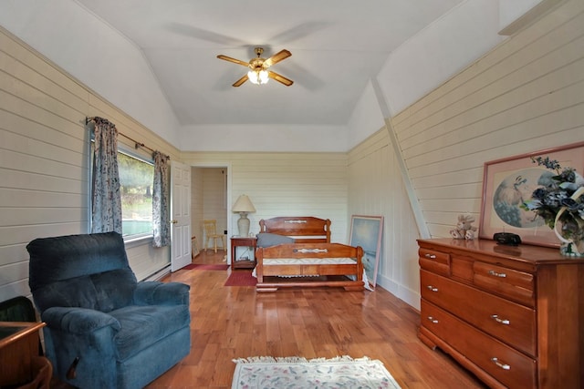 157 Shelmire Rd, Wellsboro, PA 16901 - bedroom featuring light wood-type flooring, vaulted ceiling, and wooden walls