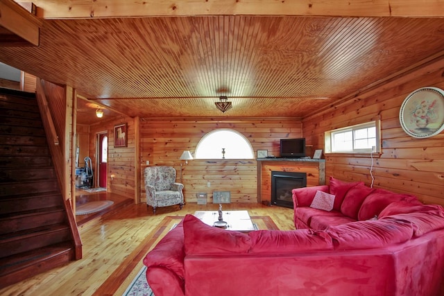 157 Shelmire Rd, Wellsboro, PA 16901 - living room featuring wood ceiling, stairway, wood walls, and a glass covered fireplace