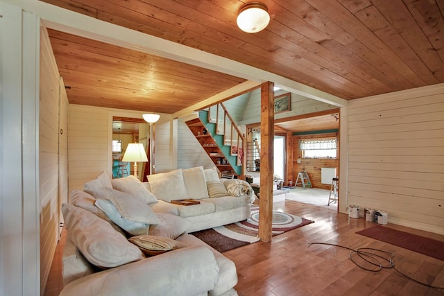 157 Shelmire Rd, Wellsboro, PA 16901 - living room with wood walls, wood ceiling, hardwood / wood-style floors, and stairs