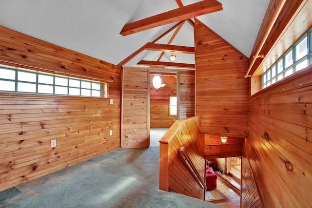 157 Shelmire Rd, Wellsboro, PA 16901 - interior space featuring wood walls, carpet flooring, lofted ceiling with beams, and an upstairs landing