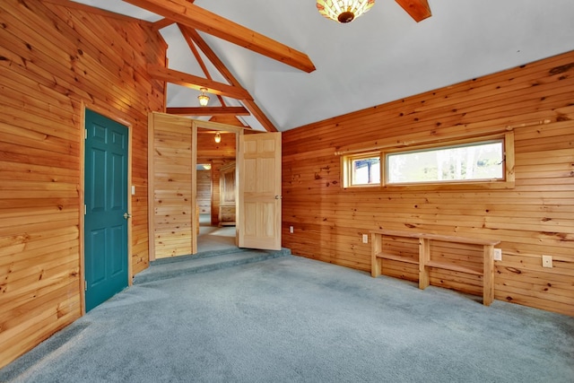 157 Shelmire Rd, Wellsboro, PA 16901 - spare room featuring wooden walls, lofted ceiling with beams, and carpet floors