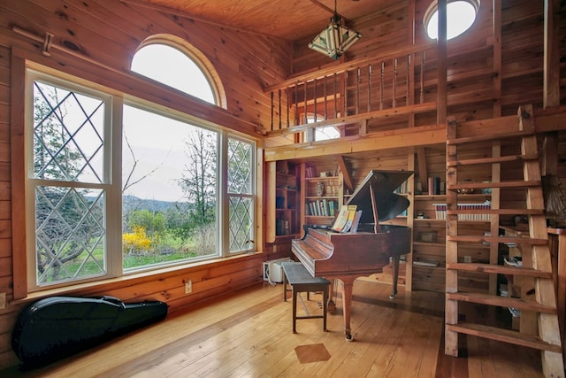 157 Shelmire Rd, Wellsboro, PA 16901 - sitting room with a wealth of natural light, wood walls, hardwood / wood-style floors, and a high ceiling