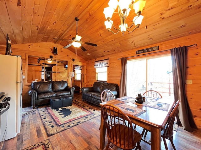 dining area with wooden walls, hardwood / wood-style flooring, vaulted ceiling, wooden ceiling, and a chandelier