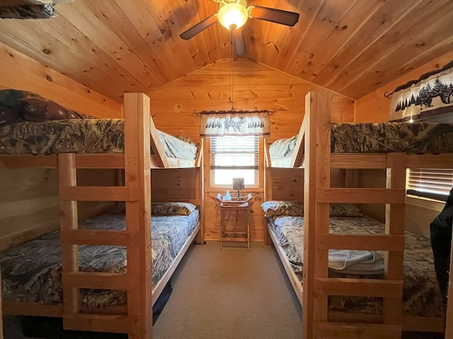 bedroom with lofted ceiling, carpet, wood ceiling, and wooden walls