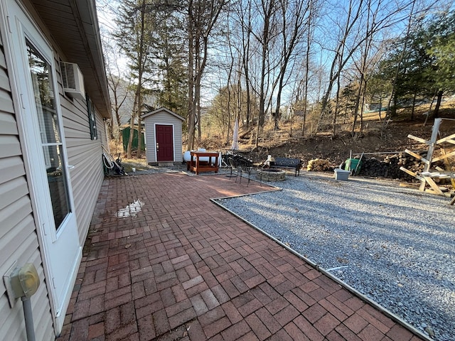 view of patio / terrace featuring a storage unit and an outdoor structure