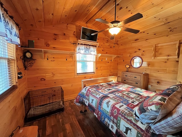 bedroom with wooden walls, a ceiling fan, wood finished floors, vaulted ceiling, and wooden ceiling