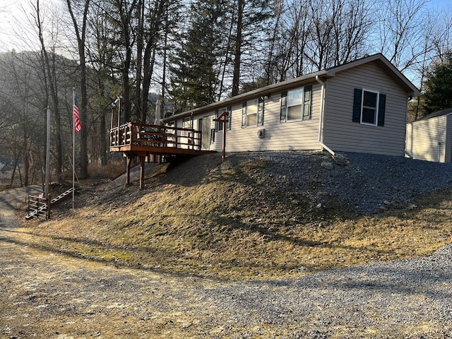 view of side of home featuring a deck