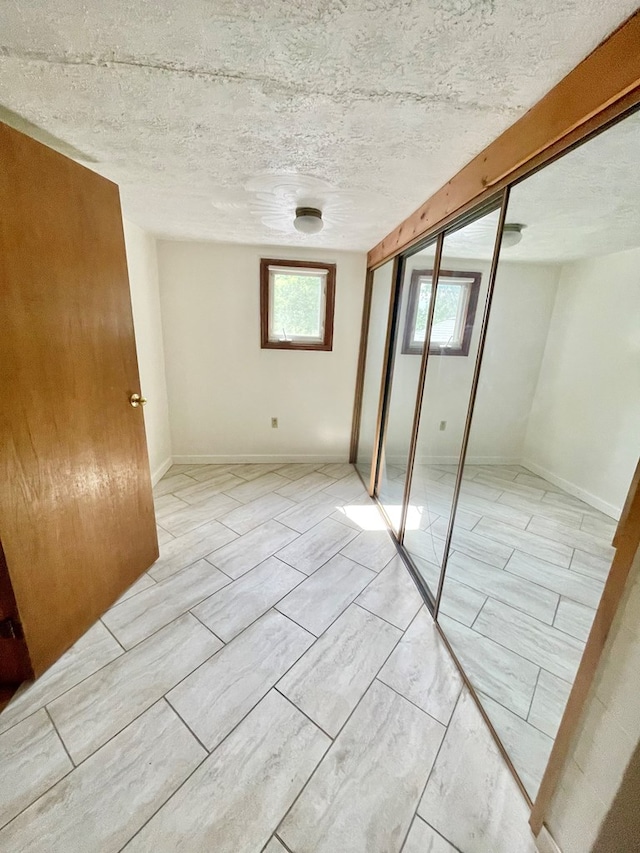 114 Elsbree St, Sayre, PA 18840 - unfurnished room featuring plenty of natural light and a textured ceiling