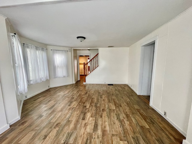 114 Elsbree St, Sayre, PA 18840 - empty room featuring wood finished floors, stairs, and baseboards