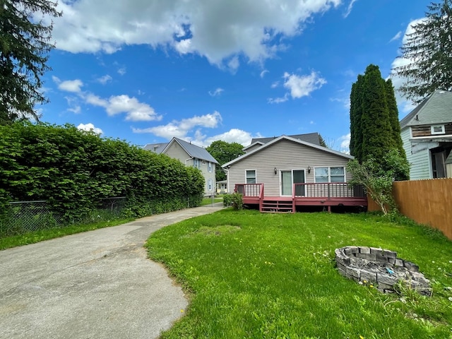 114 Elsbree St, Sayre, PA 18840 - rear view of property featuring a fire pit and a wooden deck
