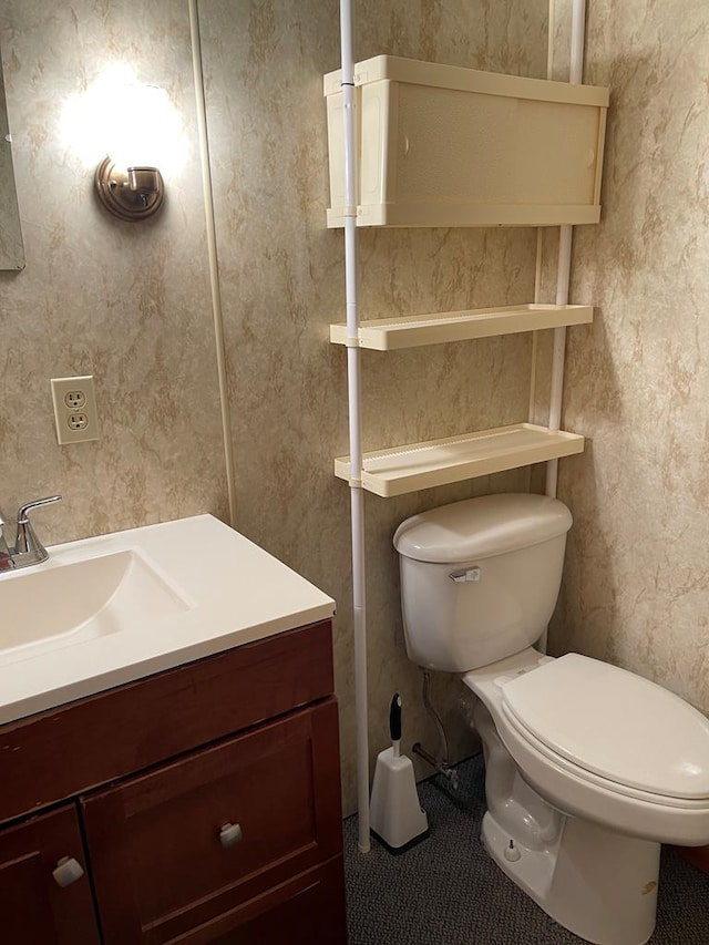 bathroom with vanity and toilet