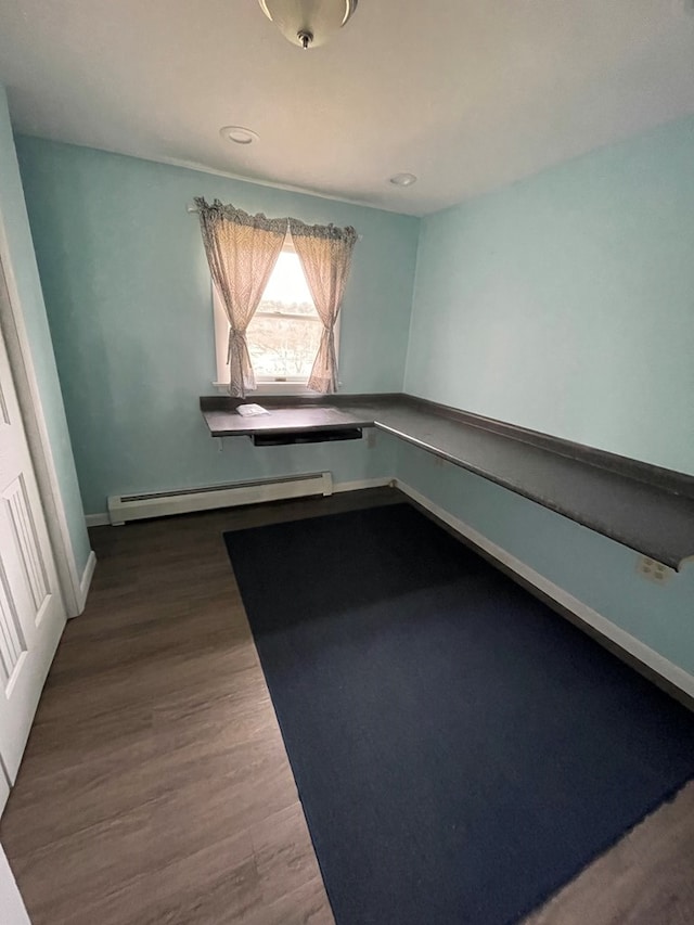 interior space featuring a baseboard radiator and wood-type flooring