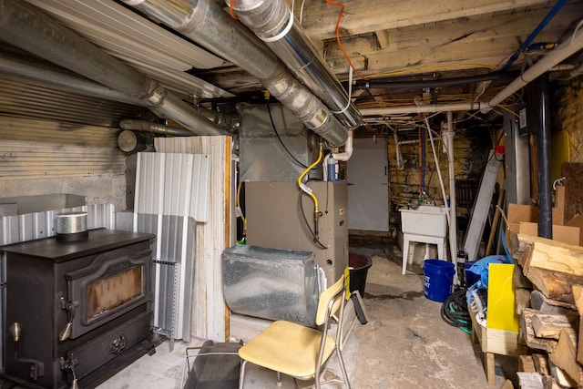 2779 Stony Fork Rd, Wellsboro, PA 16901 - unfinished below grade area featuring heating unit and a sink