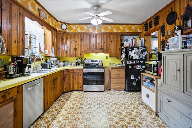 2779 Stony Fork Rd, Wellsboro, PA 16901 - kitchen featuring stainless steel appliances, a sink, a ceiling fan, brown cabinets, and light countertops