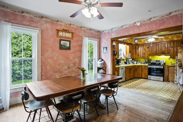 2779 Stony Fork Rd, Wellsboro, PA 16901 - dining space featuring a ceiling fan, light wood-type flooring, and wallpapered walls