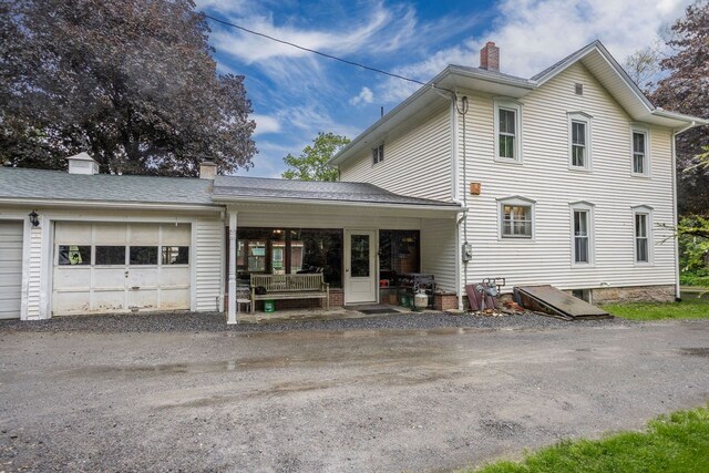 2779 Stony Fork Rd, Wellsboro, PA 16901 - view of home's exterior with an attached garage, a chimney, and driveway