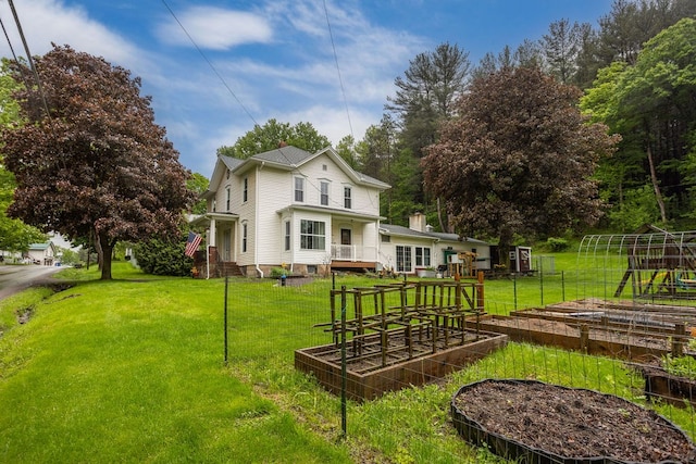 2779 Stony Fork Rd, Wellsboro, PA 16901 - back of house featuring a vegetable garden and a lawn