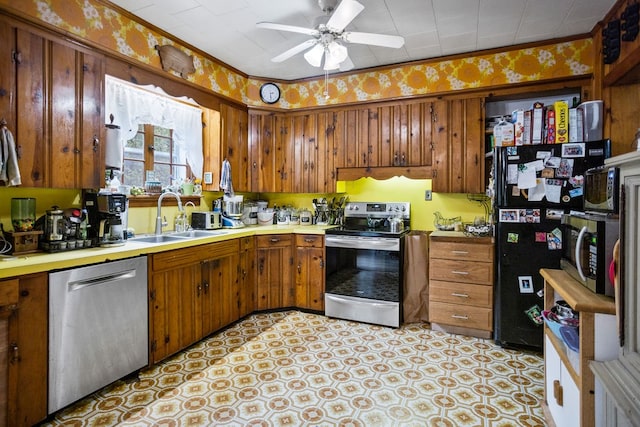 2779 Stony Fork Rd, Wellsboro, PA 16901 - kitchen with stainless steel appliances, a sink, ceiling fan, brown cabinets, and light countertops