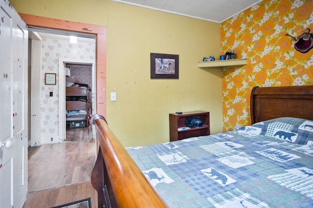 2779 Stony Fork Rd, Wellsboro, PA 16901 - bedroom featuring wallpapered walls, wood finished floors, and crown molding