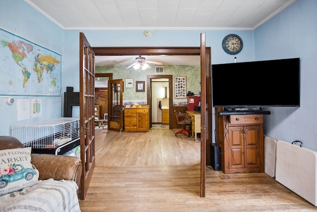 2779 Stony Fork Rd, Wellsboro, PA 16901 - living room with light wood-style flooring, crown molding, and a ceiling fan