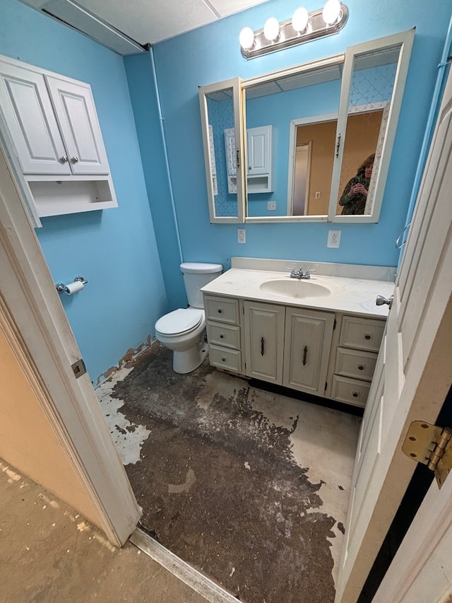 bathroom with toilet and vanity