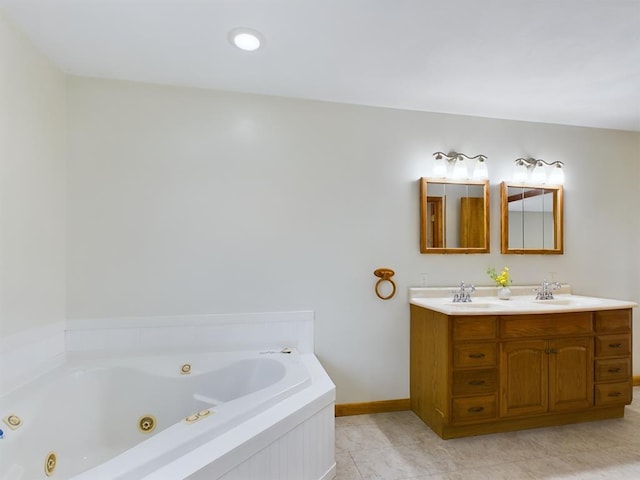 bathroom featuring tile patterned flooring, vanity, and a bathtub