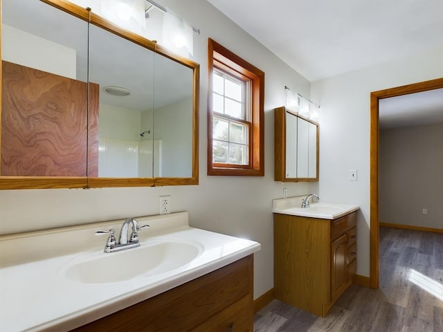 bathroom with hardwood / wood-style flooring and vanity