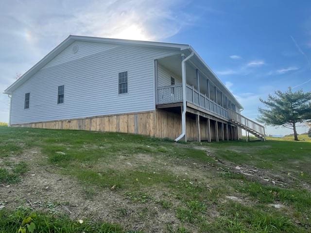 view of home's exterior with a lawn