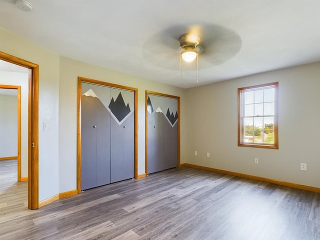 unfurnished bedroom with light wood-type flooring and ceiling fan