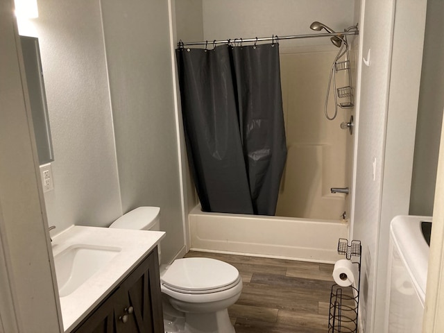 full bathroom featuring toilet, vanity, shower / tub combo with curtain, and hardwood / wood-style flooring