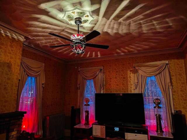 440 Park Ave, Waverly, NY 14892 - living room with radiator, wallpapered walls, a ceiling fan, and ornamental molding