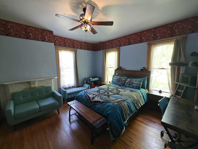 440 Park Ave, Waverly, NY 14892 - bedroom featuring wood finished floors, multiple windows, a ceiling fan, and wallpapered walls
