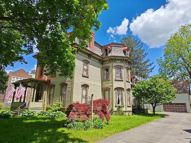 440 Park Ave, Waverly, NY 14892 - second empire-style home featuring mansard roof and a front yard